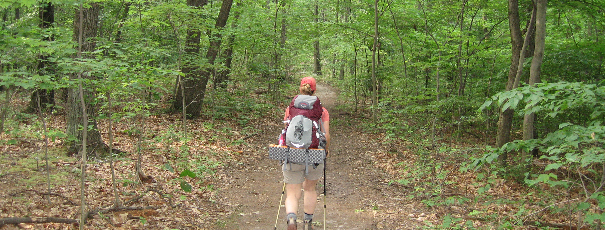Backpacker at camp with a Jacks R Better down quilt