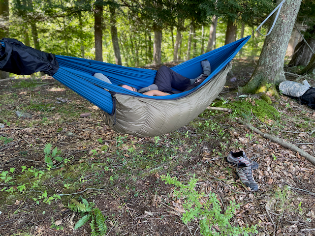 Jacks R Better down hammock underquilt hung beneath a hammock in camp — the warm alternative to a sleeping pad for hammock camping