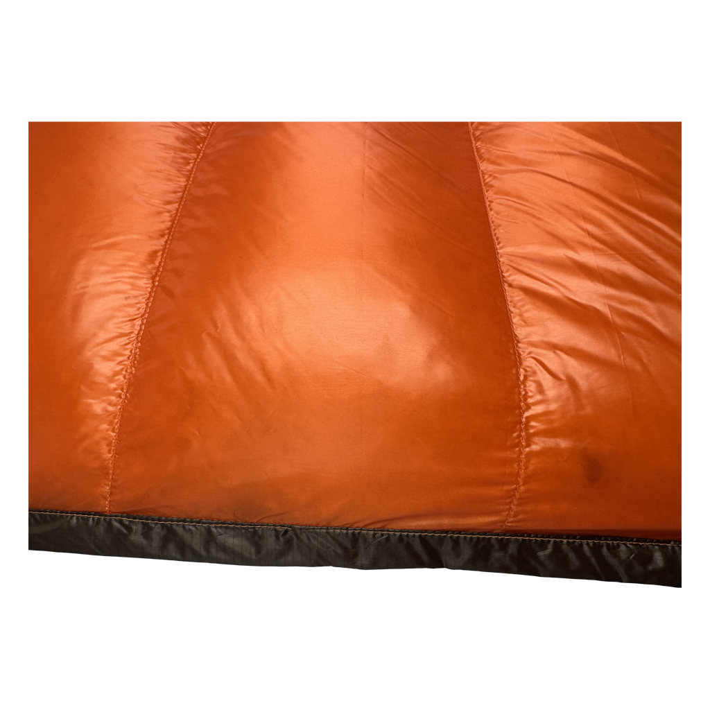 Close-up of the burnt orange sew-through baffles on the Big Meadows Ultralight 20° backpacking quilt