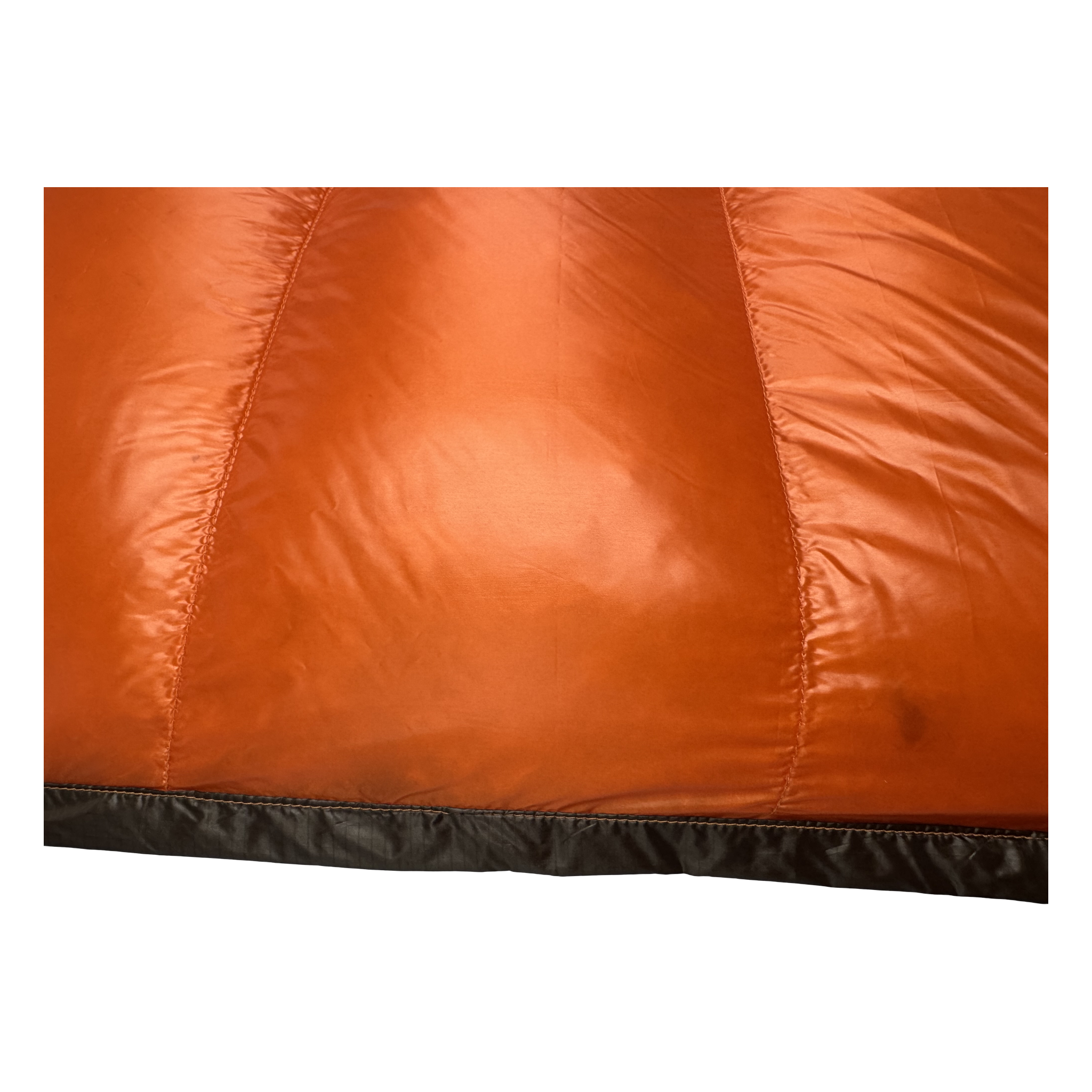 Close-up of the burnt orange sew-through baffles on the Big Meadows Ultralight 20° backpacking quilt