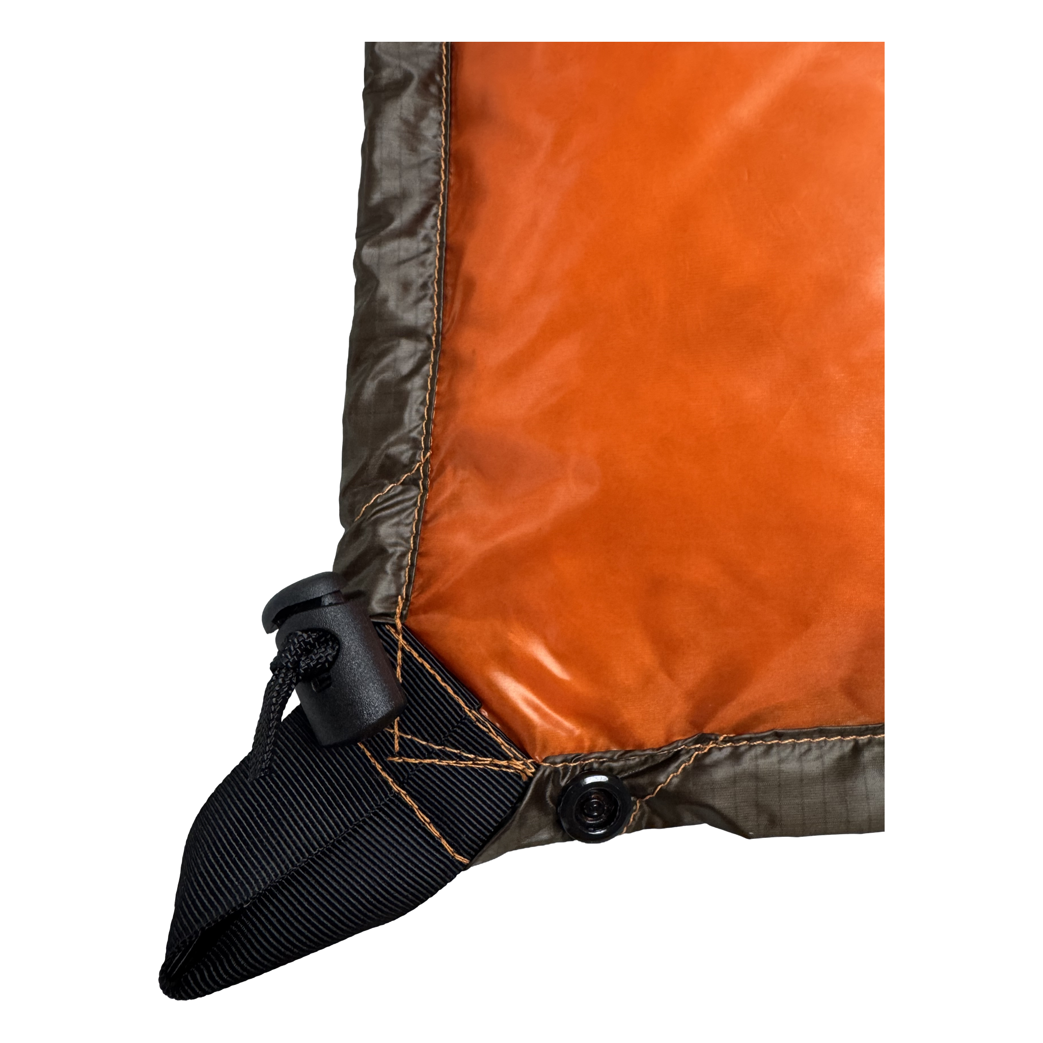 Corner detail of the Big Meadows Ultralight 20° quilt showing the drawcord, cord lock and Kam Snap used to form the foot box