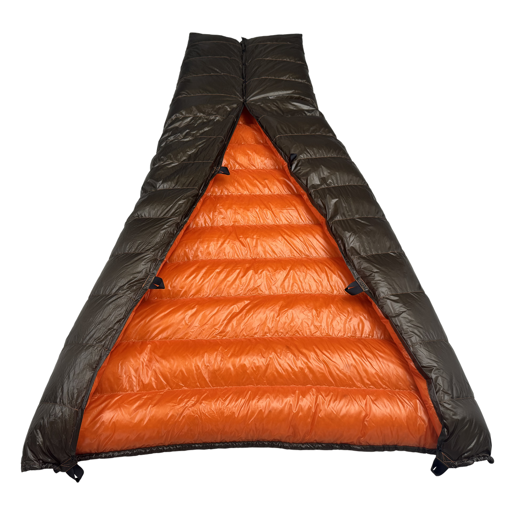Big Meadows Ultralight 20° quilt with the foot box snapped closed, viewed from the head end into the burnt orange interior