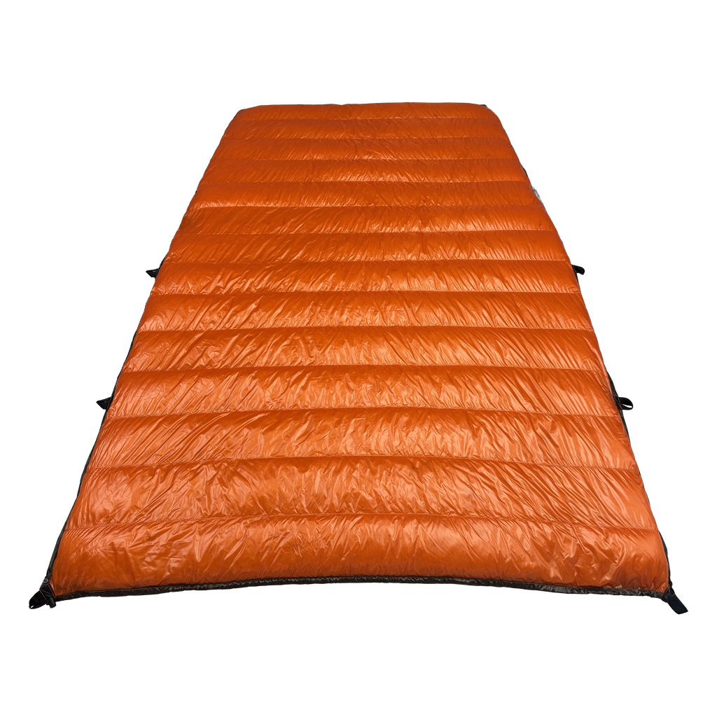 Big Meadows Ultralight 20° quilt open showing the full burnt orange interior and sew-through baffles filled with 1000 fill power down
