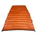 Big Meadows Ultralight 20° quilt open showing the full burnt orange interior and sew-through baffles filled with 1000 fill power down