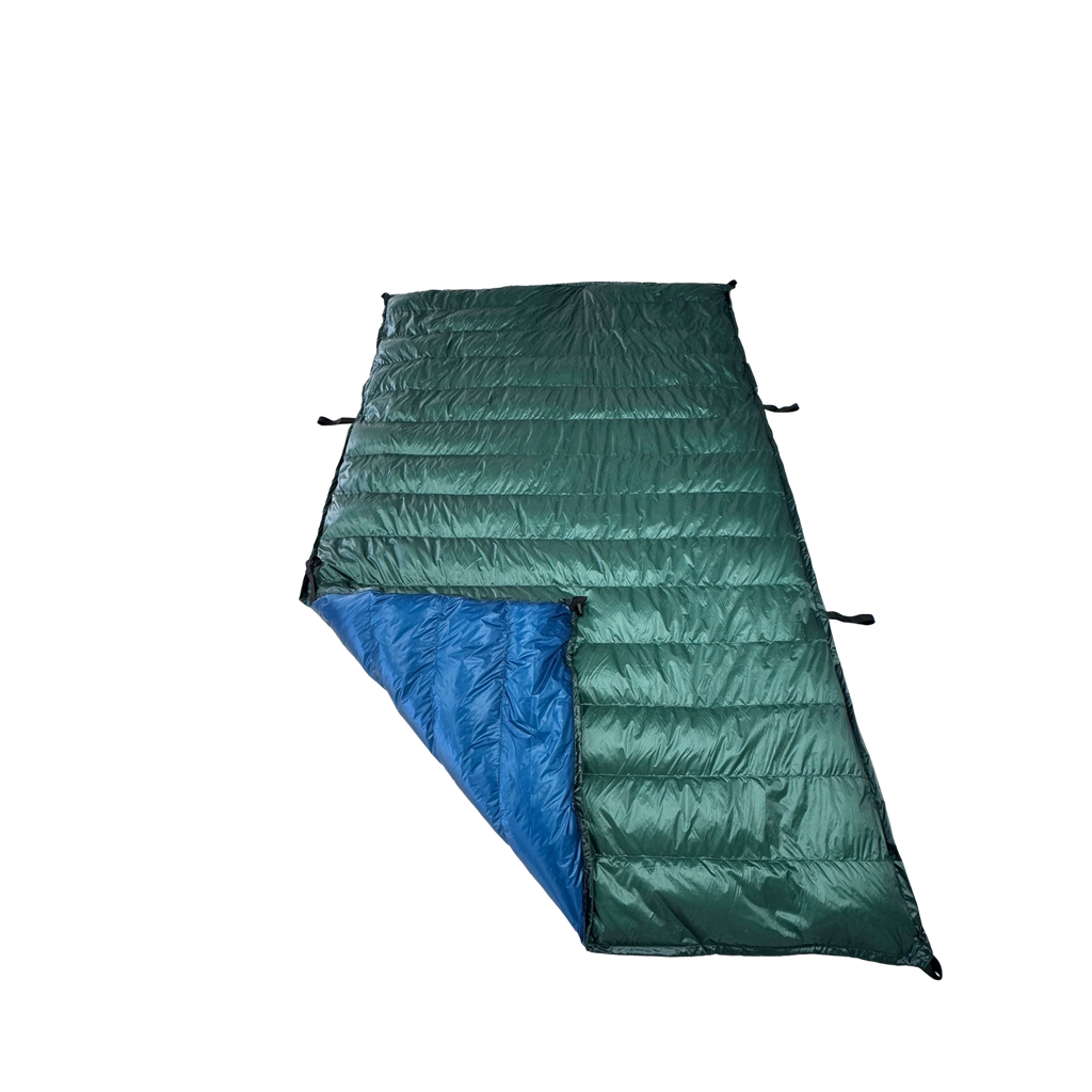 Jacks R Better Custom Ultralight Backpacking Quilt with a Forest Green shell and Moroccam Blue lining, shown on a white background