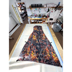 Custom ultralight backpacking quilt in the Lifestyle Camo Wildfire print, black with orange and red flames