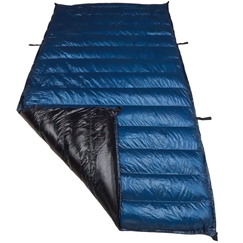 Jacks R Better Hudson River Ultralight 20 degree backpacking quilt laid flat with corner folded back showing Moroccan Blue Argon 67 shell and black Argon 67 interior lining with attachment loops