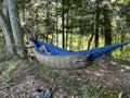 Jacks R Better Mt Washington 3 20°F three-season hammock underquilt hung beneath a camping hammock