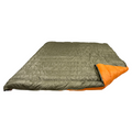 Jacks R Better Overland 20°F overlanding and RV camping quilt laid flat, dark olive shell with the corner turned back to show the burnt orange lining