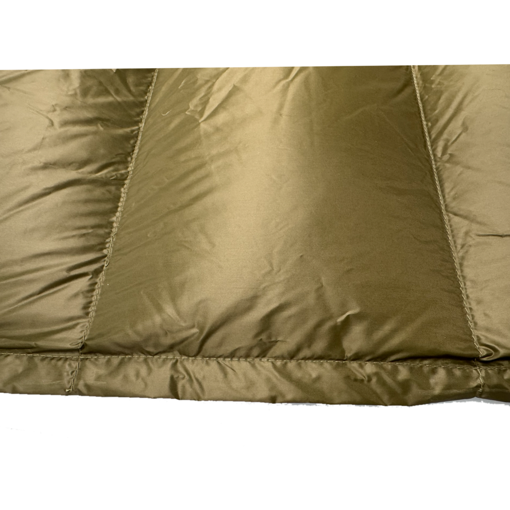 Close-up detail of Jacks R Better Shenandoah 40 degree camping quilt showing olive taffeta shell fabric and baffle construction