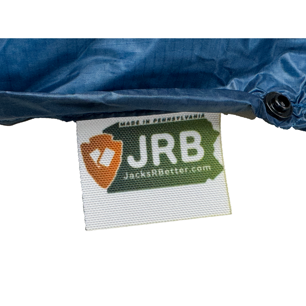Close-up of the woven Jacks R Better logo tag on the Shenandoah Ultralight 40 degree backpacking quilt