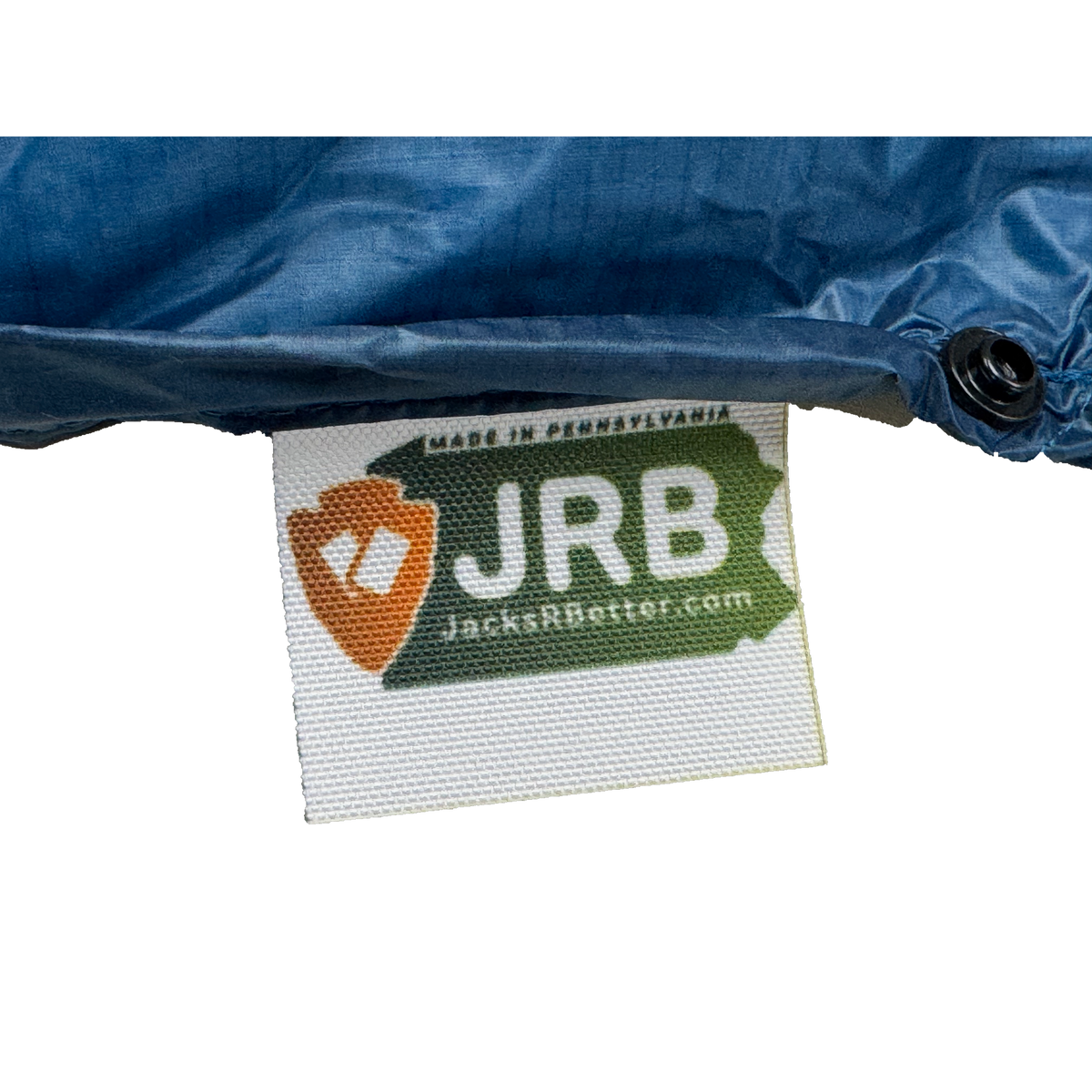 Close-up of the woven Jacks R Better logo tag on the Shenandoah Ultralight 40 degree backpacking quilt
