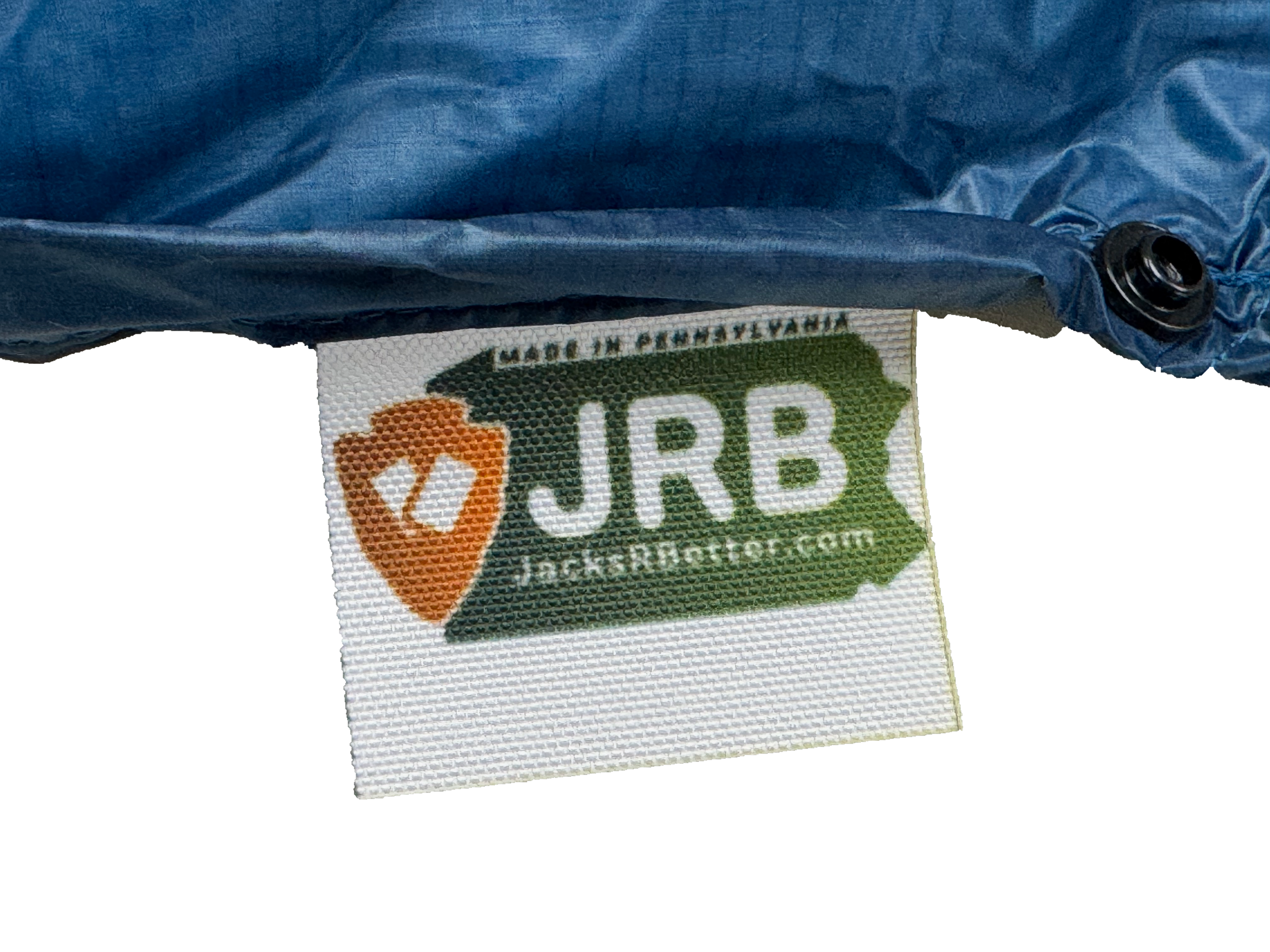 Close-up of the woven Jacks R Better logo tag on the Shenandoah Ultralight 40 degree backpacking quilt
