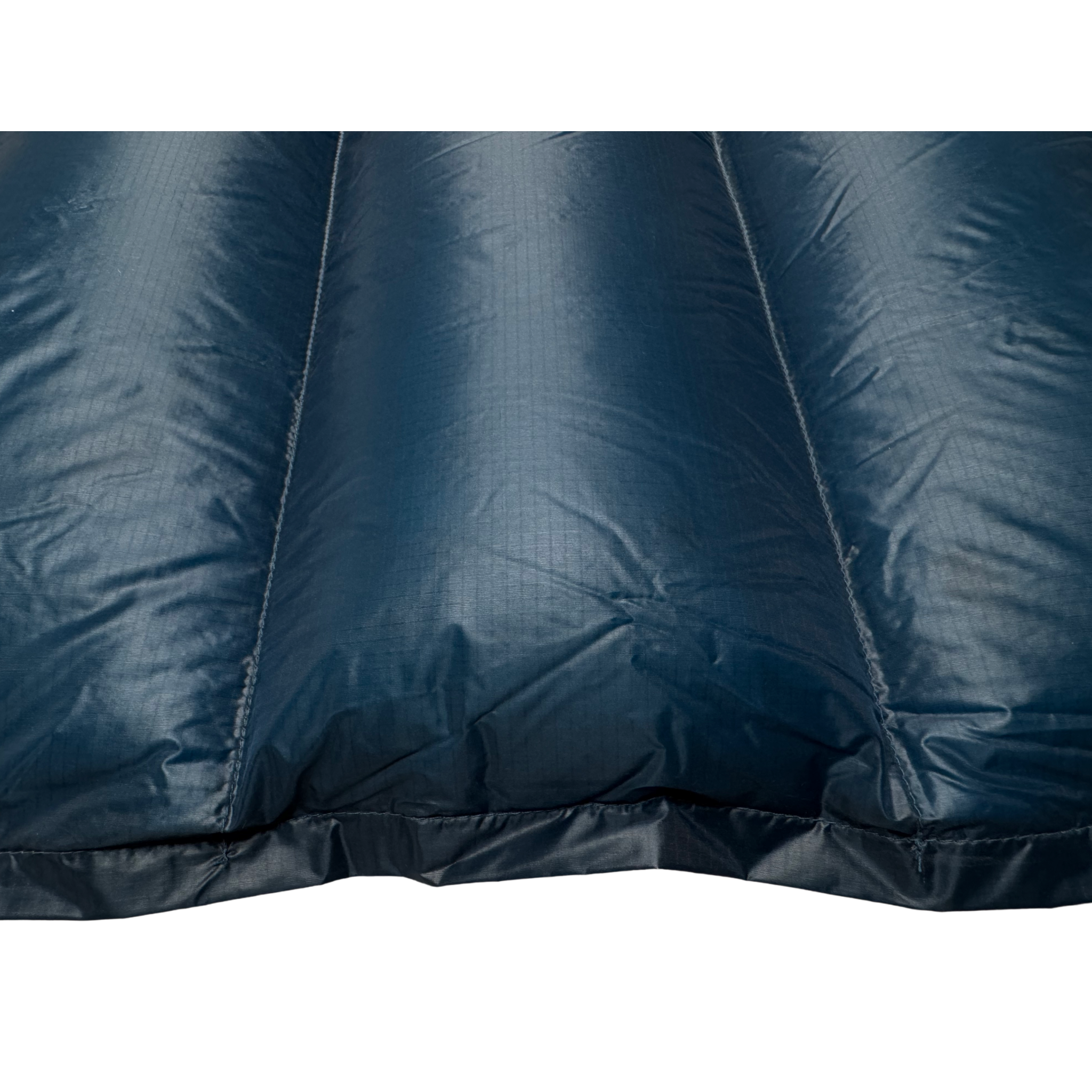 Close-up detail of Jacks R Better Shenandoah Ultralight 40 degree backpacking quilt showing Moroccan Blue Argon 67 ripstop shell and baffle loft