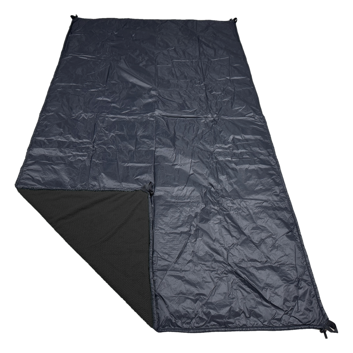 Jacks R Better Wind Gap Alpha wind liner in Black Alpha Direct 90 with the black Ion 1.1 windproof shell, corner folded back to show the Alpha Direct face
