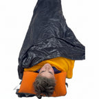Jacks R Better Windproof Shell open at top showing Alpha Direct liner underneath – layered sleep system